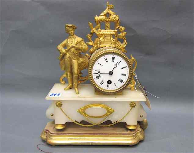 Appraisal: PETITE GILT METAL AND WHITE ONYX STATUE CLOCK ON PLINTH