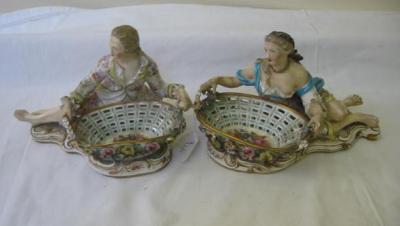 Appraisal: A PAIR OF CONTINENTAL PORCELAIN SWEETMEAT DISHES modelled as a