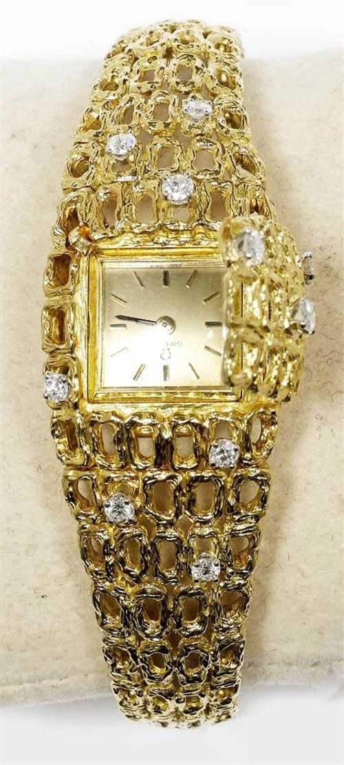 Appraisal: GOLD AND DIAMOND LADY'S WRISTWATCH OMEGA s Yellow gold g