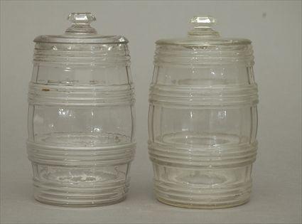 Appraisal: Two Pressed Flint Glass Barrel-Form Jars Each in in diam