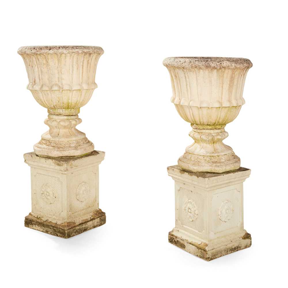 Appraisal: PAIR OF COMPOSITION STONE URNS AND PEDESTALS EARLY TH CENTURY