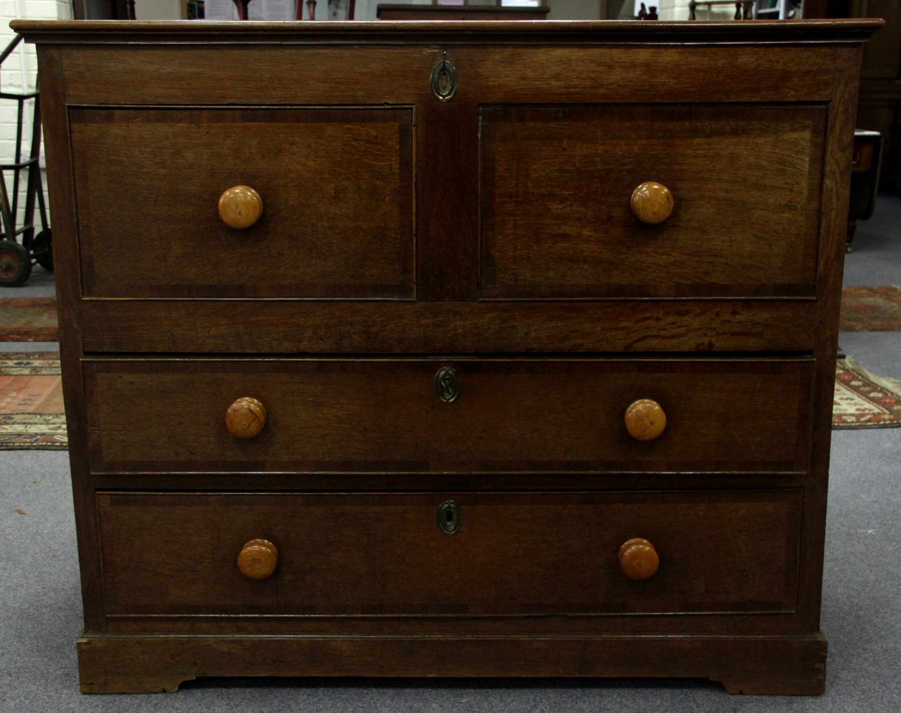 Appraisal: An early th Century oak mule chest with hinged cover