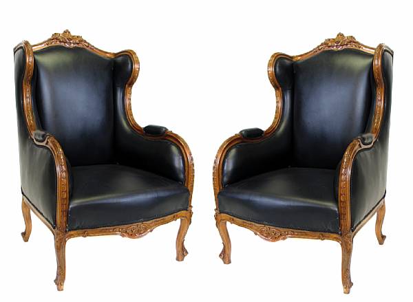 Appraisal: A pair of Regence style black upholstered bergeres height in