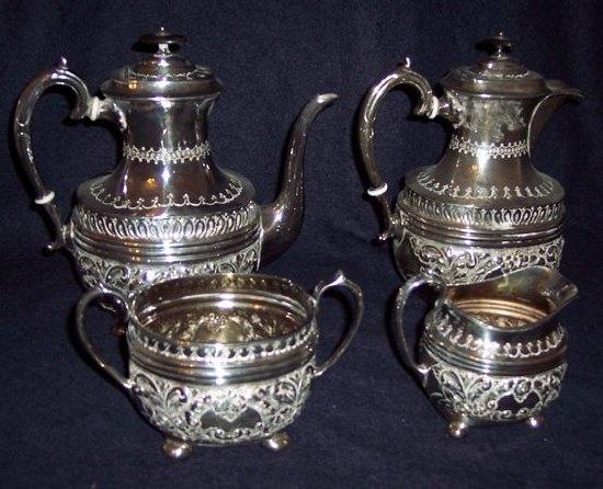 Appraisal: A four-piece coffee service comprising coffee pot hot water jug