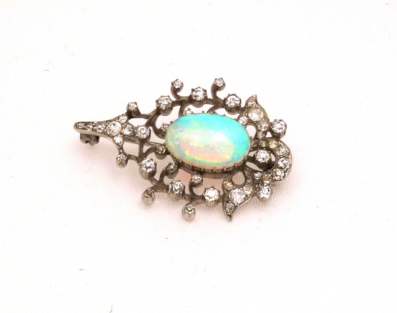 Appraisal: A late Victorian opal and diamond brooch centred with a