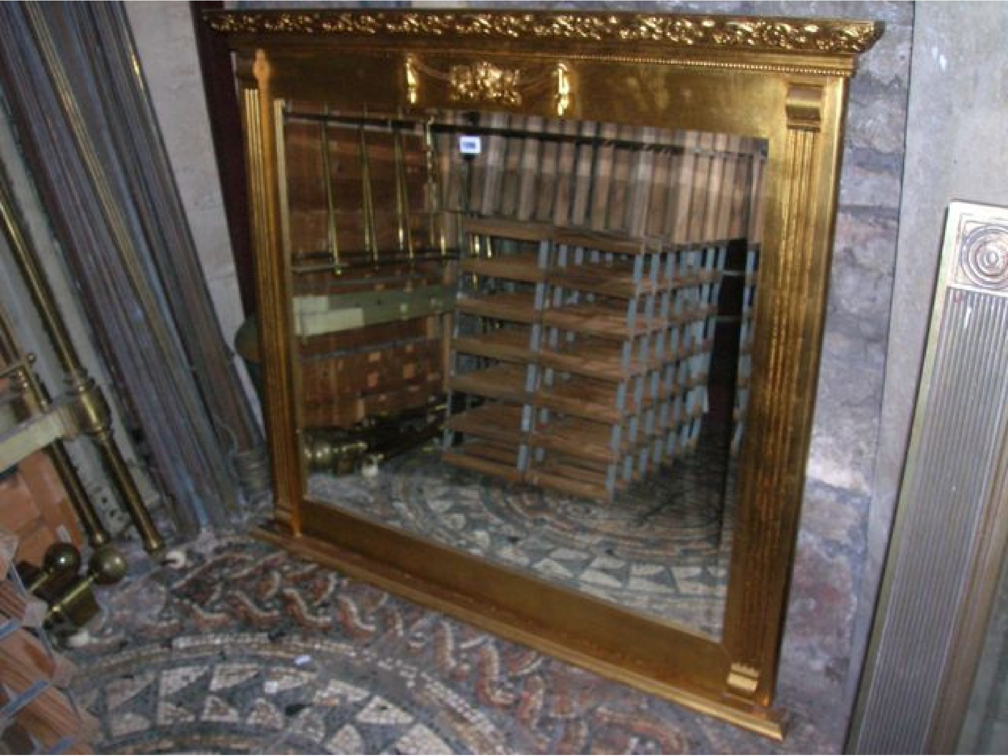 Appraisal: A contemporary reproduction overmantle mirror with rectangular bevelled edge plate