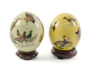 Appraisal: A PAIR OF DECORATED OSTRICH EGGS ON STANDS A PAIR