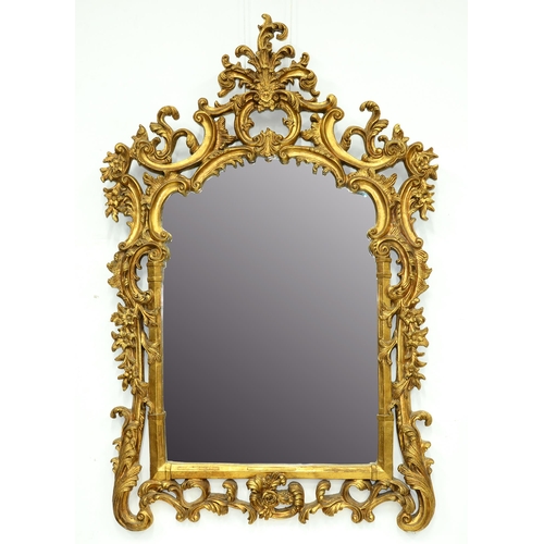 Appraisal: A rococo style gilt mirror and a similar reproduction console