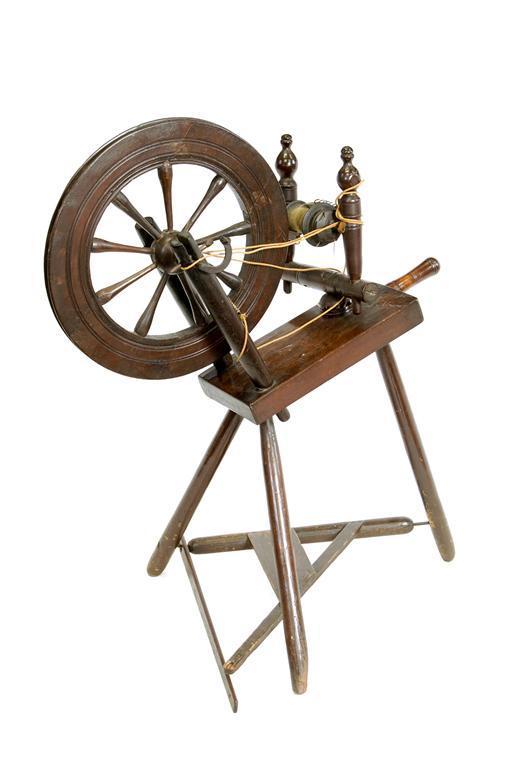 Appraisal: An th century oak fruitwood and pine spinning wheel