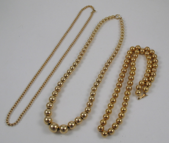 Appraisal: THREE FOURTEEN KARAT GOLD NECKLACES All beaded necklaces two are