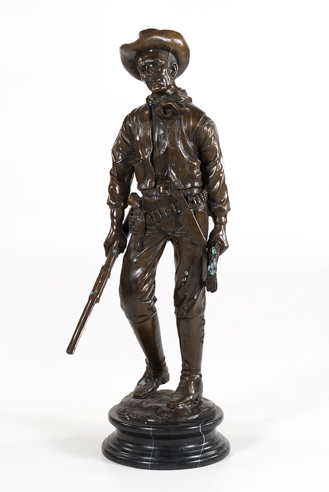 Appraisal: BRONZE FIGURE OF A COWBOY ModernStanding holding a rifle and