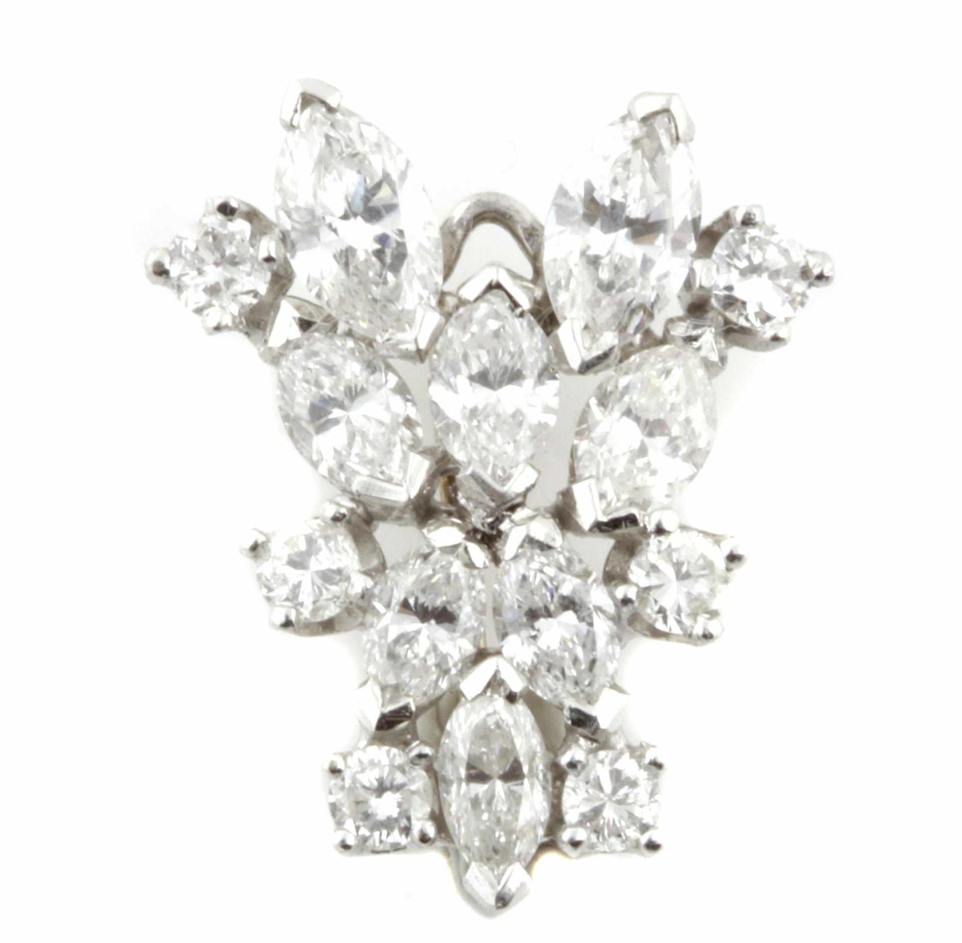 Appraisal: A diamond and white gold cluster pendant featuring marquise and