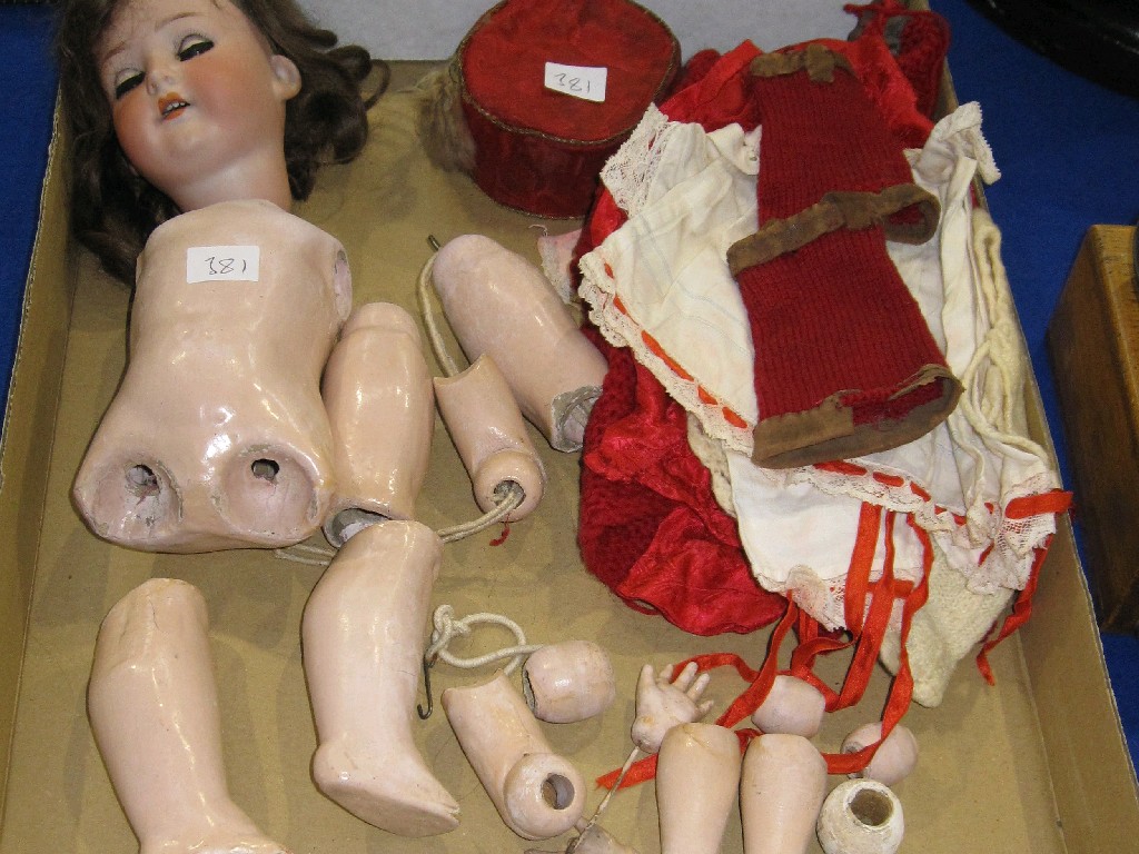 Appraisal: German Bisque headed doll in parts and a quantity of