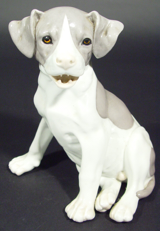 Appraisal: Continental porcelain seated dog with open mouth impressed factory marks