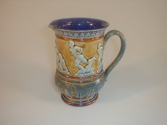 Appraisal: A Doulton Lambeth pottery jug sprigged with figures playing rugby