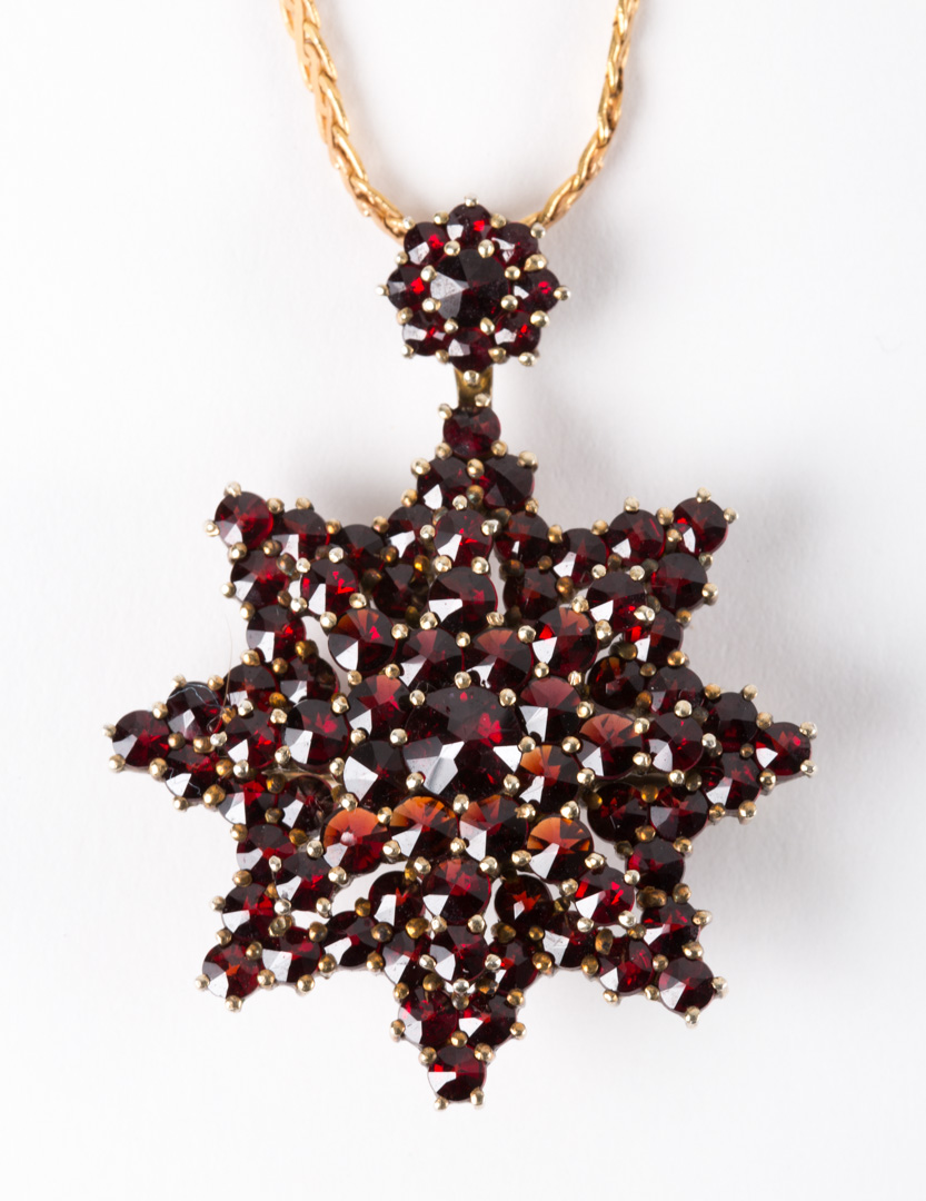 Appraisal: A Garnet Pendant with Neck Chain suspending a Victorian garnet