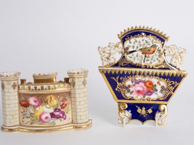 Appraisal: An English porcelain spill vase card rack of castle form