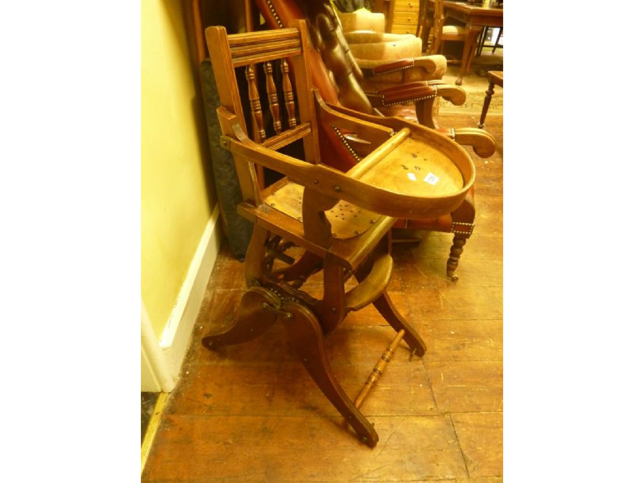 Appraisal: An Edwardian metamorphic child's high chair principally in beechwood with