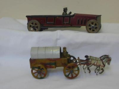 Appraisal: Two tin plate penny toys chauffeur driven town car clockwork