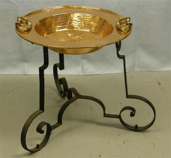 Appraisal: Copper twin-handled dish on wrought iron tripod stand the copper