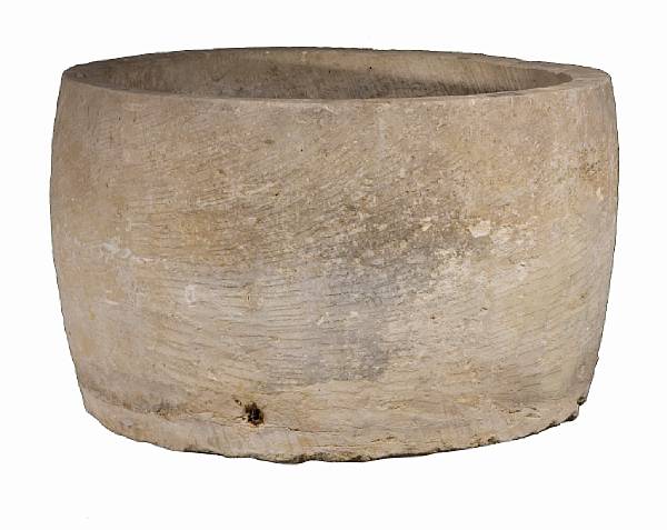 Appraisal: A large Continental stone cistern th century Of irregular cylindrical