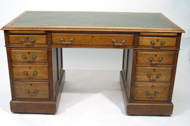 Appraisal: Edwardian oak twin pedestal desk with green tooled leather inserts