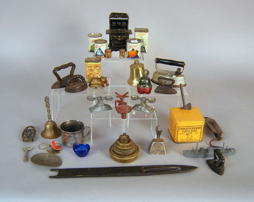 Appraisal: Miscellaneous table articles to include miniature irons tins bells etc