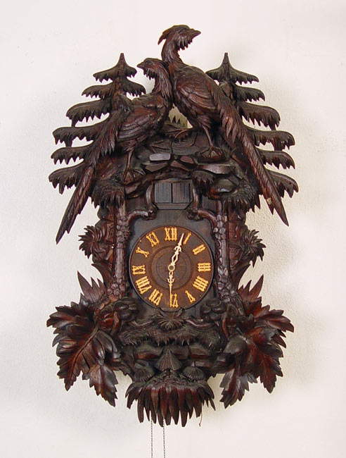 Appraisal: IMPRESSIVE BLACK FOREST CARVED CUCKOO CLOCK Early th century carvings