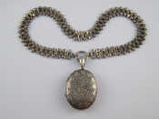 Appraisal: A Victorian silver locket and chain locket hallmarked Birmingham approx