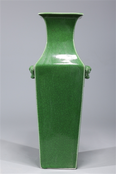 Appraisal: Chinese green glazed faceted porcelain vase with molded mask handles