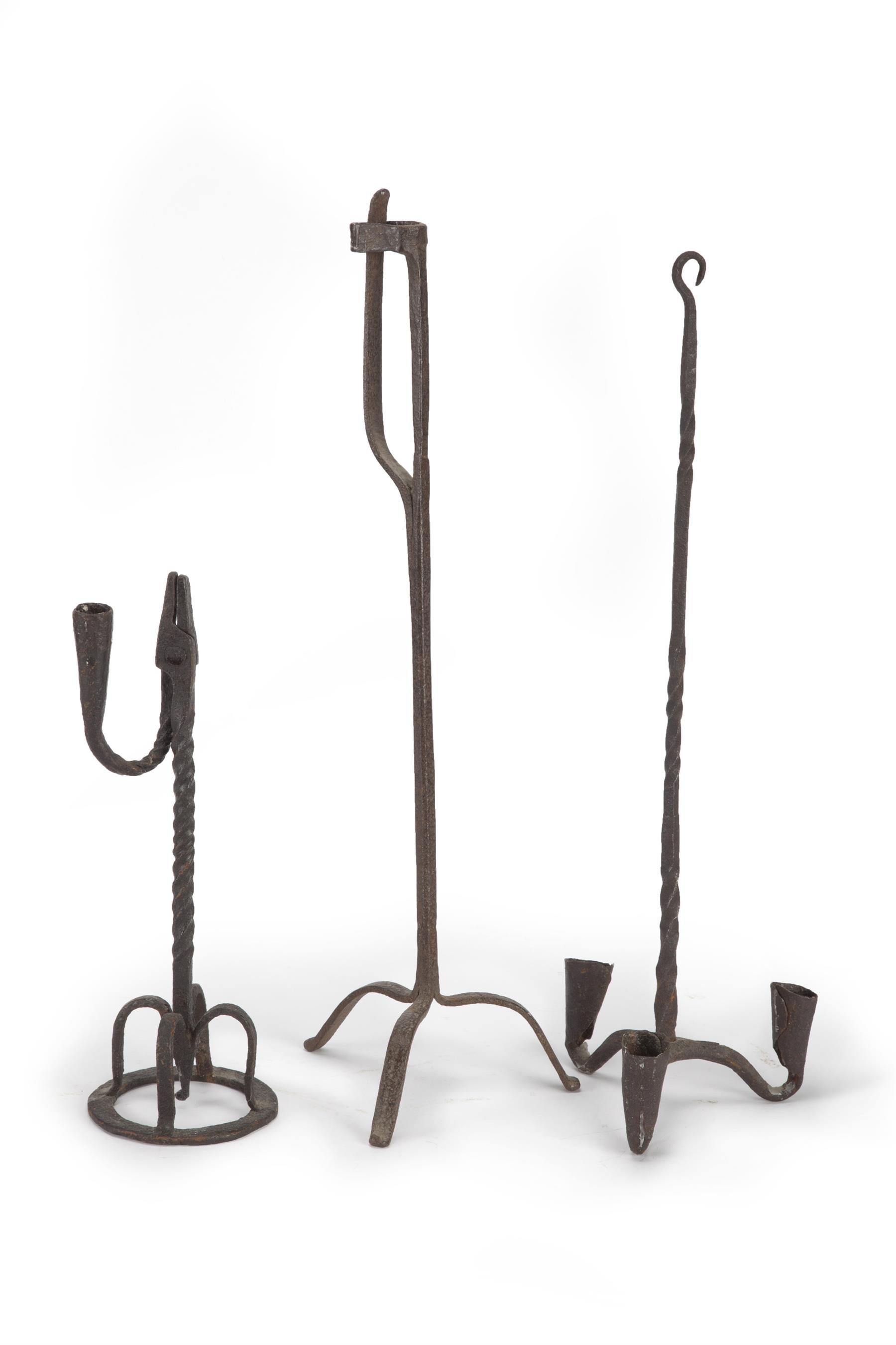 Appraisal: THREE AMERICAN WROUGHT IRON LIGHTING DEVICES Nineteenth century Two rushlight