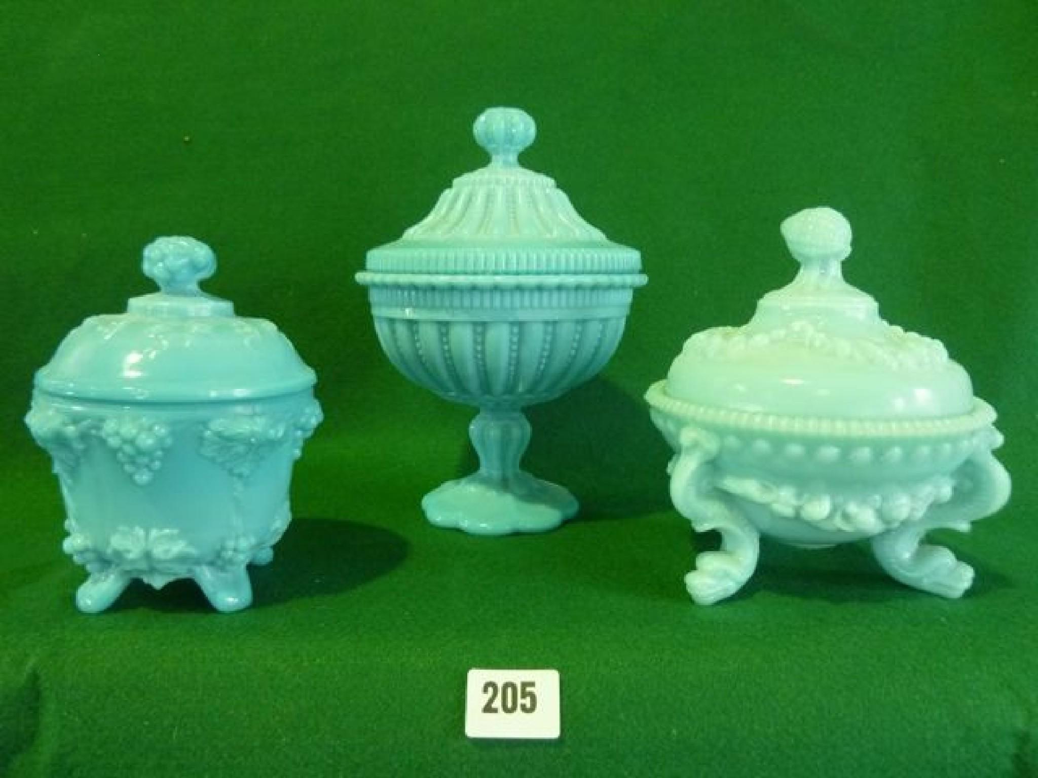 Appraisal: Three th century blue milk glass lidded containers of various