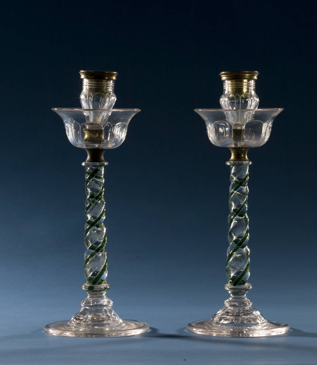 Appraisal: PAIR OF ENGLISH BLOWN GLASS CANDLESTICKS WITH GREEN SPIRAL STEMS