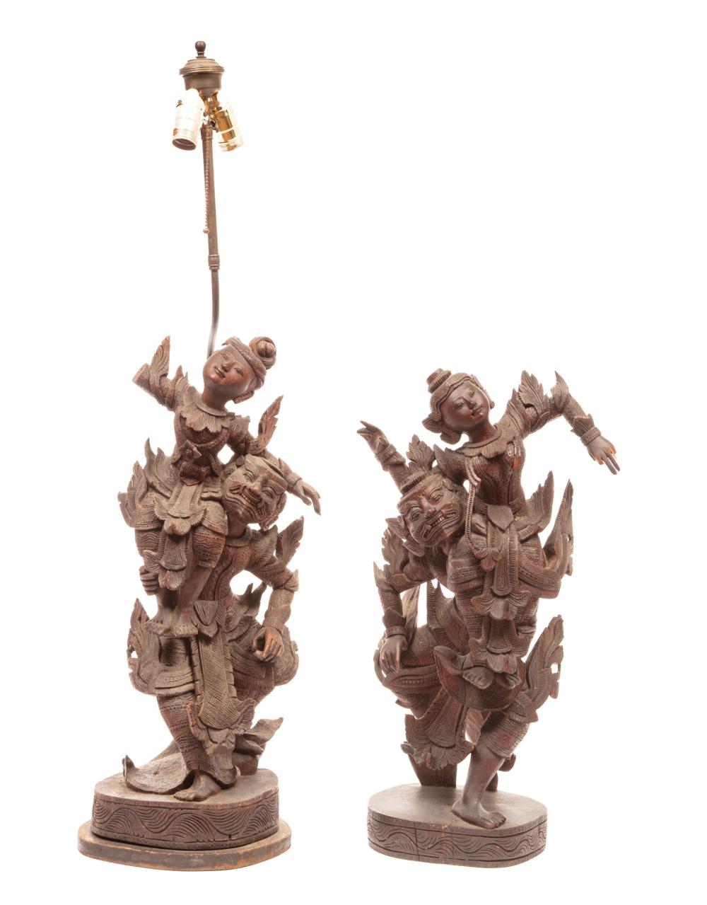 Appraisal: Pair of Indonesian Carved Wood Figural Groups each carved in