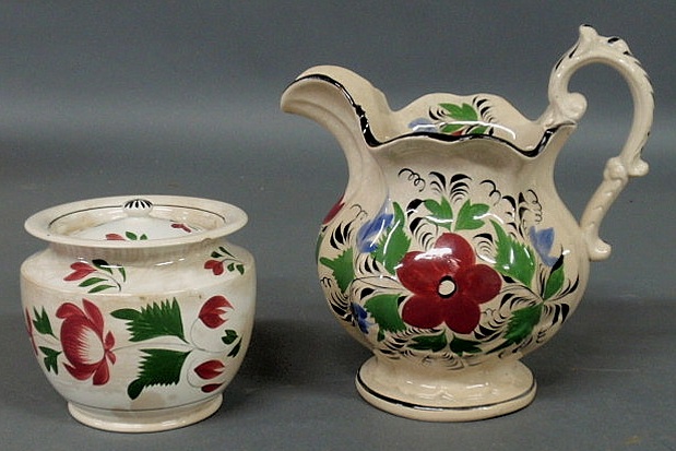 Appraisal: English soft paste covered sugar bowl h and a pitcher