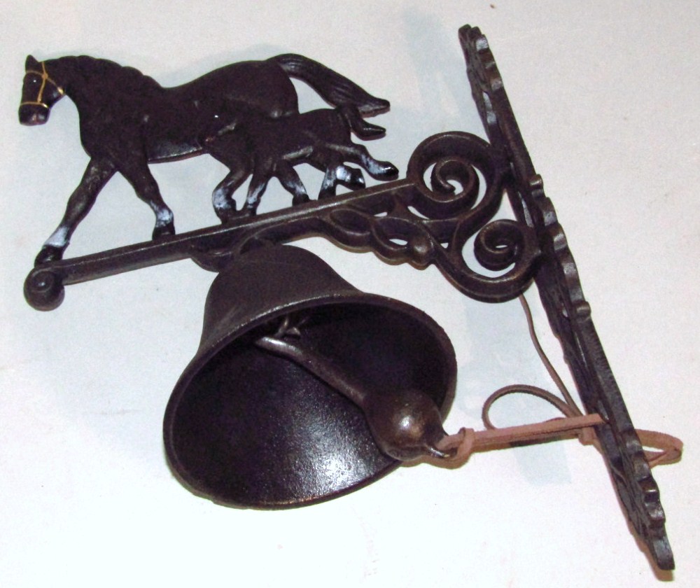 Appraisal: A modern house bell surmounted by a horse with shaped