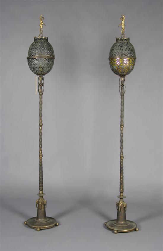 Appraisal: A Pair of Iron and Gilt Bronze Torcheres Oscar B