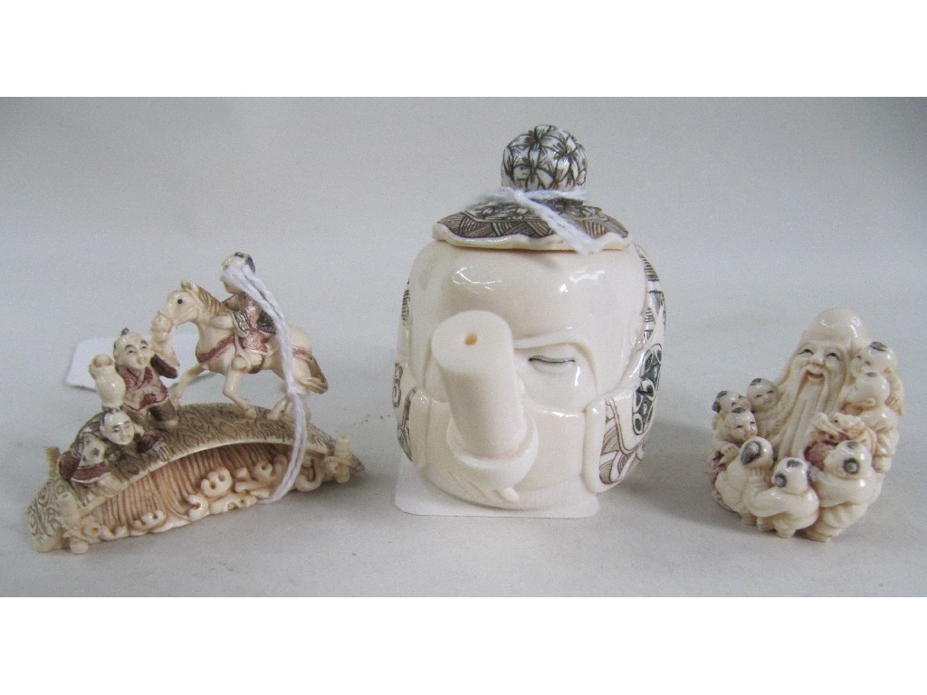 Appraisal: Lot comprising two mammoth tusk netsuke and a miniature teapot