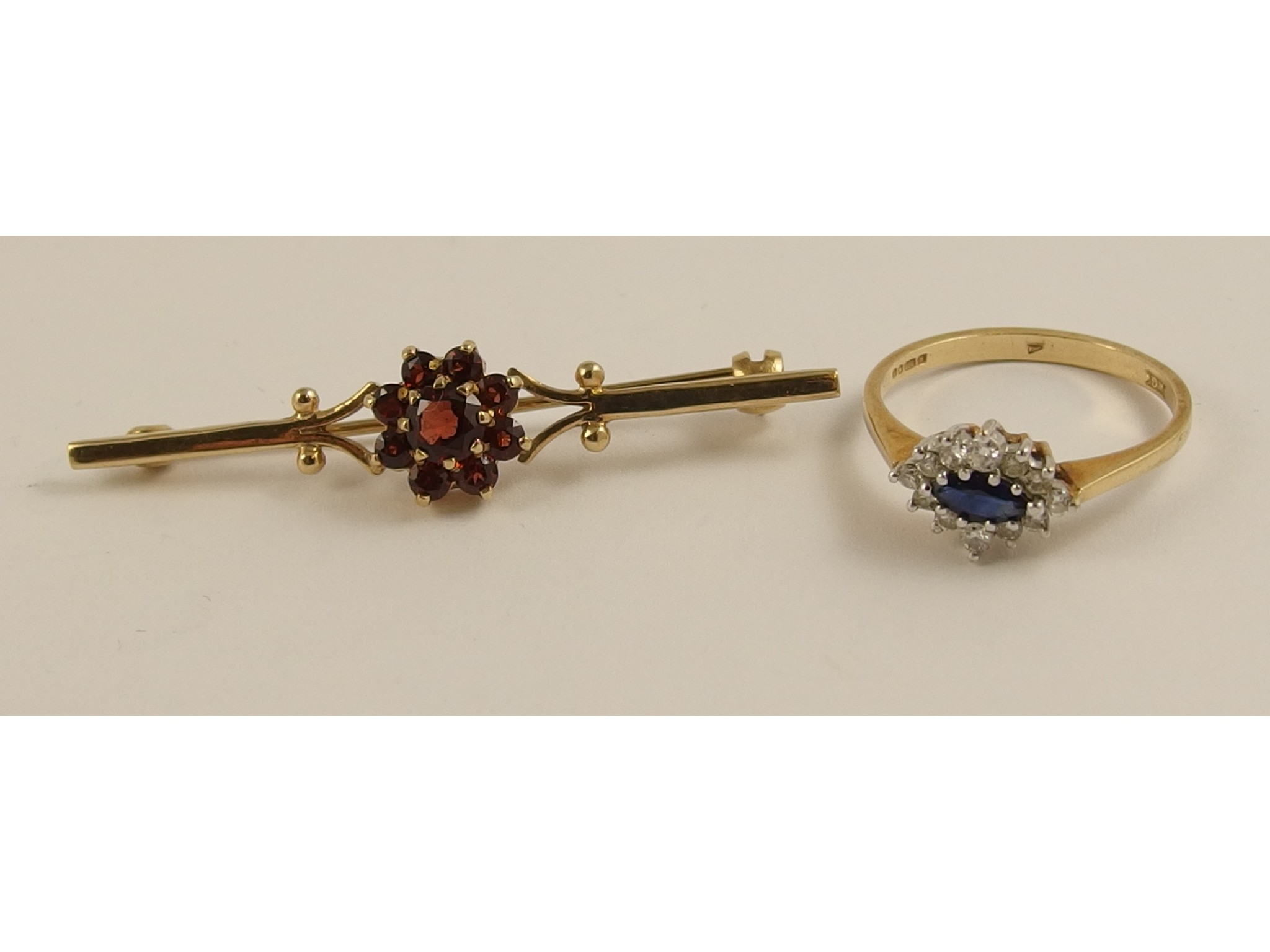 Appraisal: A ct sapphire and diamond ring and a ct garnet