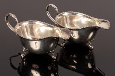 Appraisal: A pair of silver sauce boats Harry Synyer Charles Joseph