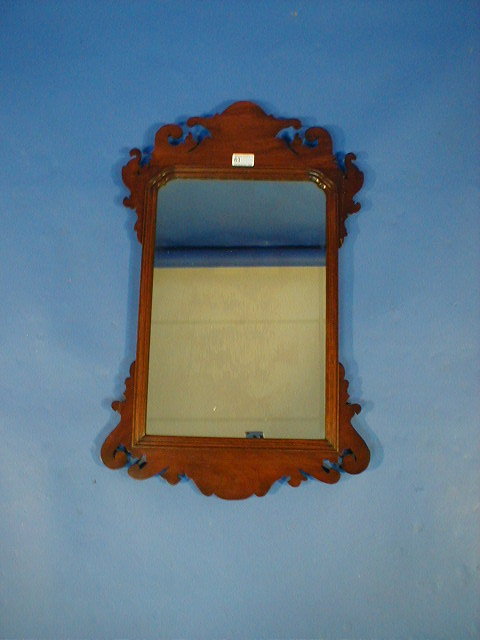 Appraisal: A walnut framed pier glass in the Chippendale manner and