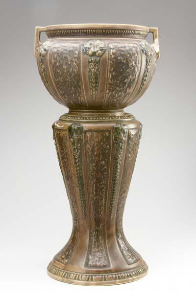 Appraisal: ROSEVILLE Brown Florentine jardiniere and pedestal set Chips to jardiniere