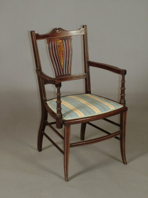 Appraisal: An Edwardian mahogany and inlaid open armchair with upholstered seat