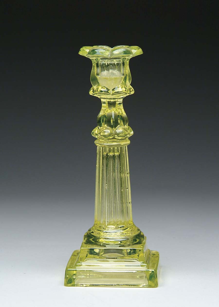 Appraisal: SANDWICH GLASS CANDLESTICK Wonderful yellow Sandwich glass candlestick has pillar