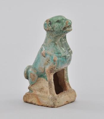 Appraisal: A Turquoise Glazed Earthenware Figurine of a Seated Dog Modeled