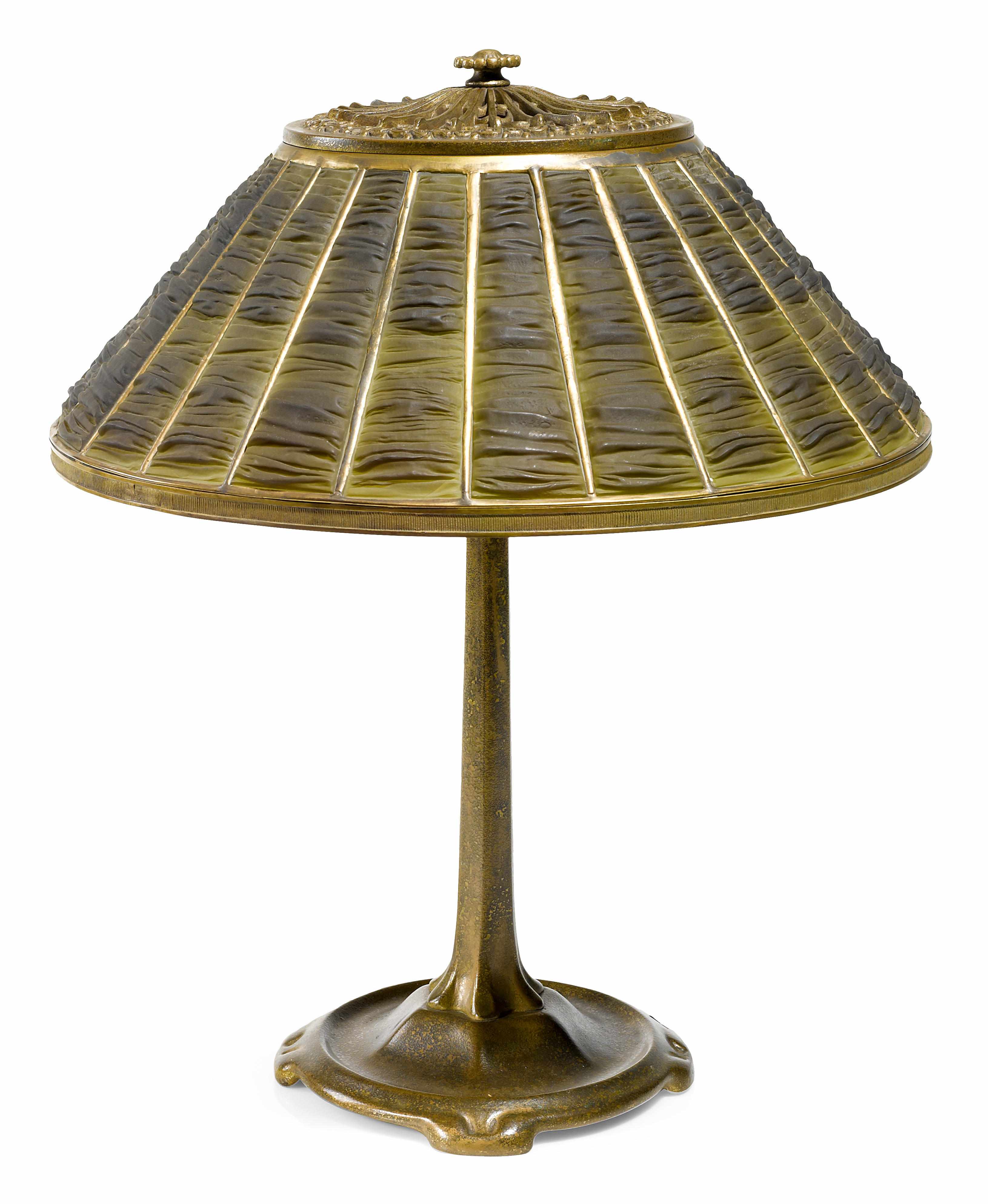 Appraisal: A Tiffany Studios Favrile glass and gilt bronze linenfold table