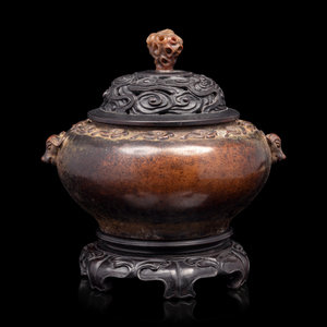 Appraisal: A Chinese Bronze Incense Burner of compressed globular form resting