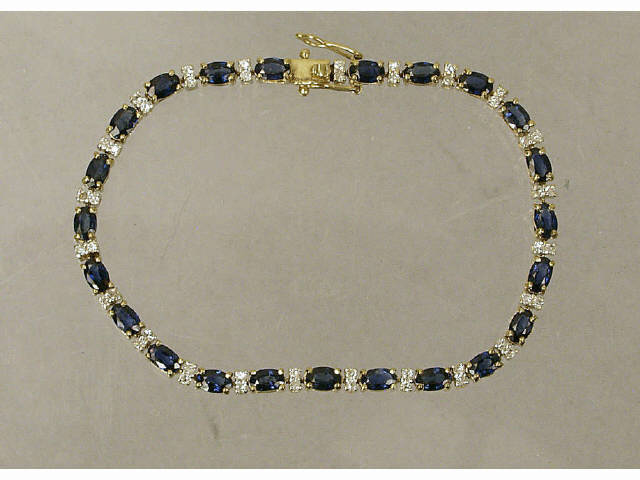 Appraisal: Lady's K gold tennis bracelet set with oval cut London