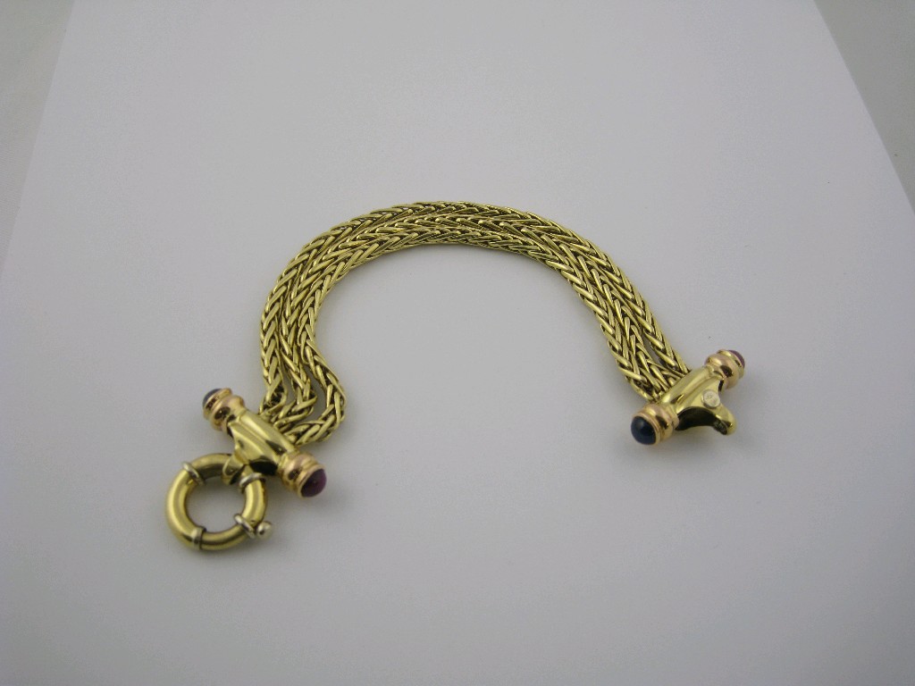 Appraisal: A Continental triple strand foxtail link ct gold Bracelet set