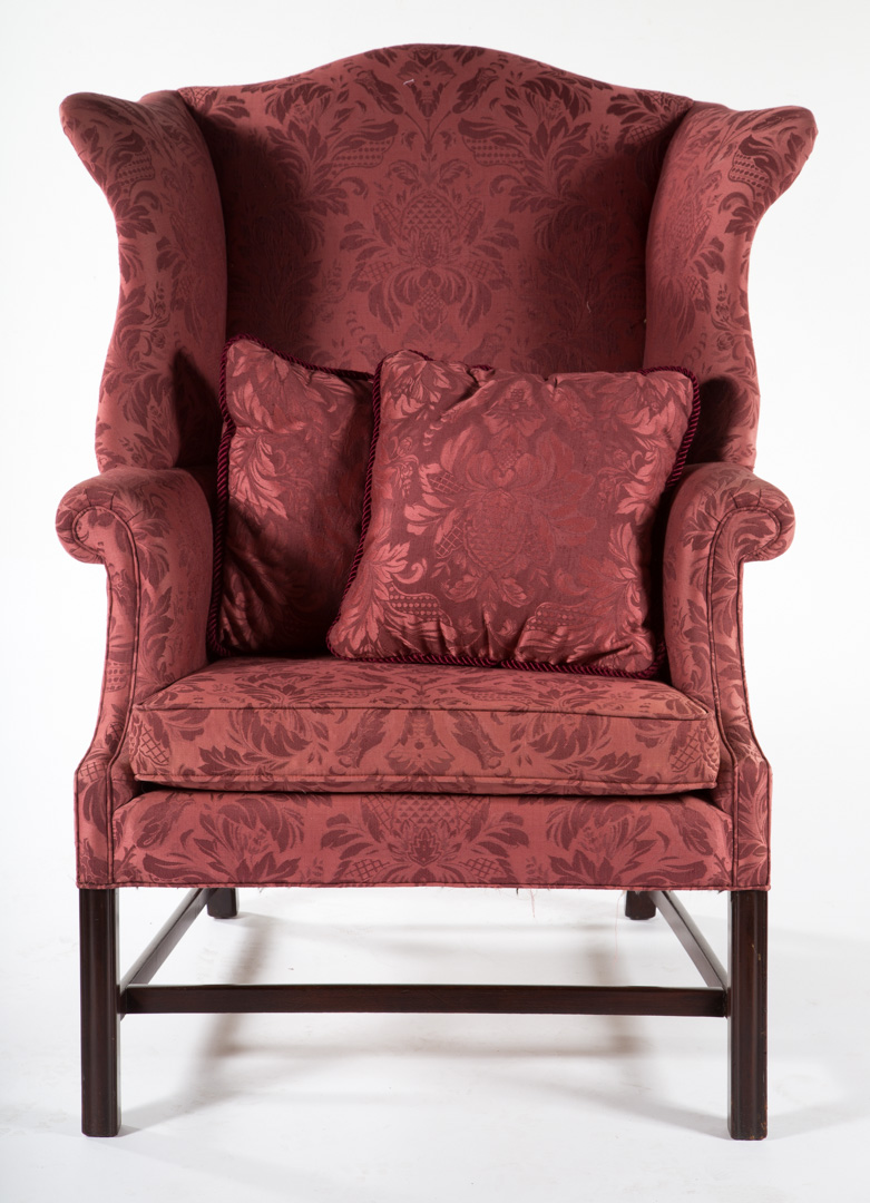 Appraisal: Chippendale style upholstered mahogany wing chair th century shaped crest